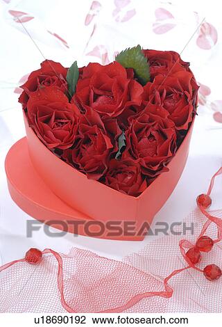 Red roses in a heartshape box View Large Photo Image Stock Image - Red roses in a heartshape box. Fotosearch
