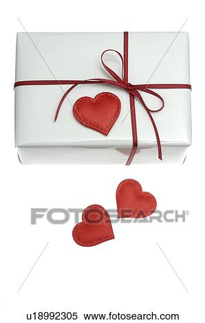 White wrapped gift with red hearts View Large Photo Image Stock Photography - White wrapped gift with red hearts. Fotosearch