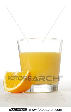 Stock Photo - A glass of orange juice. Fotosearch