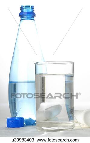 Bottle and glass of sparkling table water View Large Photo Image Stock Image - Bottle and glass of sparkling table water. Fotosearch