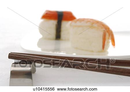 Stock Photograph - Chopsticks and sushi. Fotosearch