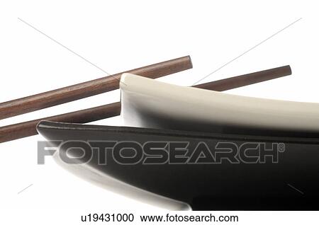 Chopsticks and white and black plates View Large Photo Image Stock Image - Chopsticks and white and black plates. Fotosearch