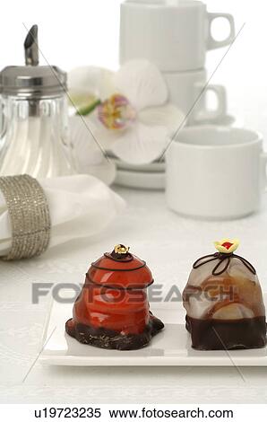 Stock Photography - Coffee set and Petit Fours. Fotosearch