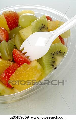 Stock Photo - Fruit salad in a plastic bowl. Fotosearch