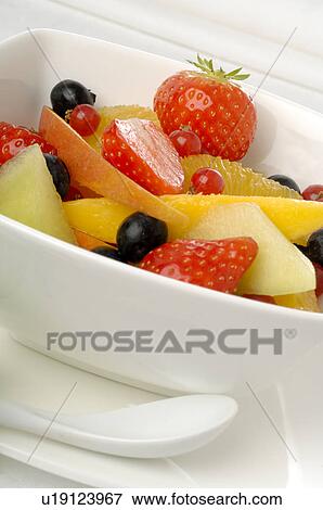Fruit salad in a white porcelain bowl View Large Photo Image Stock Photo - Fruit salad in a white porcelain bowl. Fotosearch