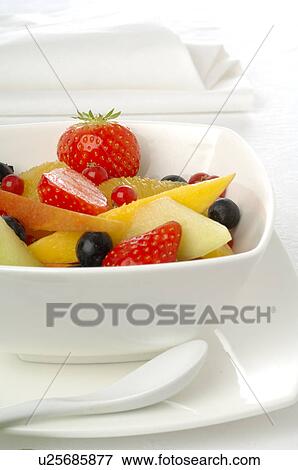 Fruit salad in a white porcelain bowl View Large Photo Image Stock Photo - Fruit salad in a white porcelain bowl. Fotosearch