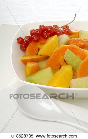 Stock Photography - Fruit salad in a white porcelain bowl. Fotosearch