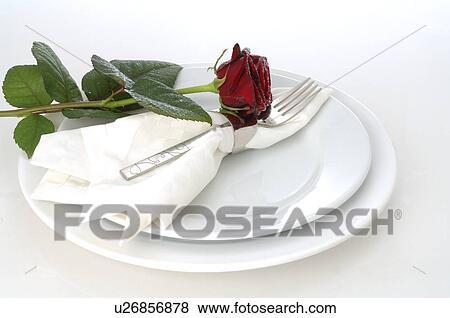Stock Photo - Place setting with a red rose. Fotosearch