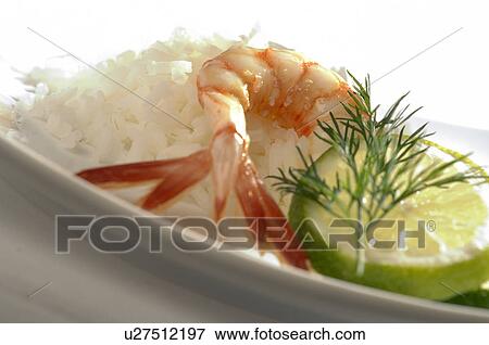 Stock Photo - Shrimps, rice and lime. Fotosearch