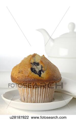 Tea pot and a muffin View Large Photo Image Stock Image - Tea pot and a muffin. Fotosearch