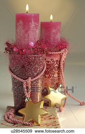 Stock Photo - Christmas candles with star shape Christmas tree hanger. Fotosearch