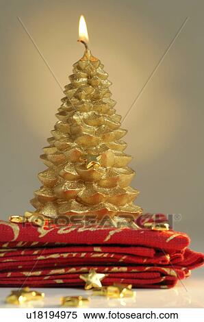 Stock Photography - Christmas tree shape candle. Fotosearch