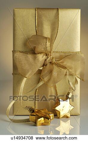 Golden Christmas gift View Large Photo Image Stock Photo - Golden Christmas gift. Fotosearch
