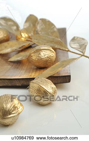 Stock Photo - Golden walnuts. Fotosearch