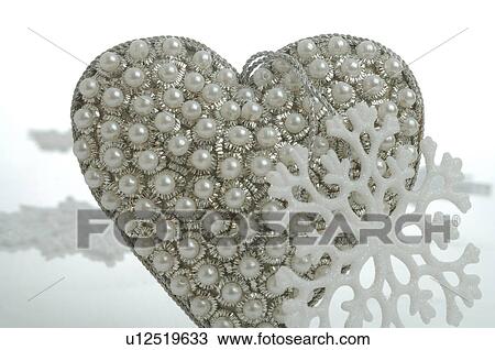 Stock Image - Heart embellished with pearls. Fotosearch