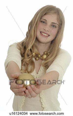 Picture - Woman holding a Christmas tree ball. Fotosearch