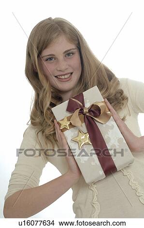 Picture - Woman with a Christmas gift. Fotosearch