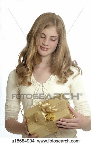 Picture - Woman with a Christmas gift. Fotosearch