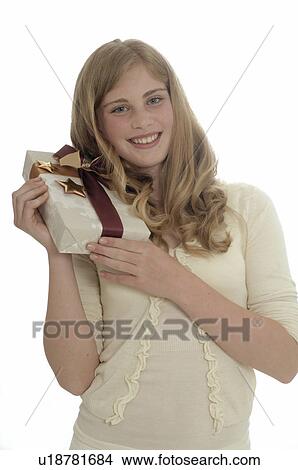 Woman with a Christmas gift View Large Photo Image Picture - Woman with a Christmas gift. Fotosearch