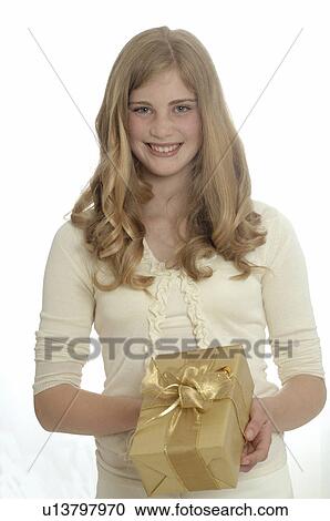 Woman with a Christmas gift View Large Photo Image Stock Image - Woman with a Christmas gift. Fotosearch