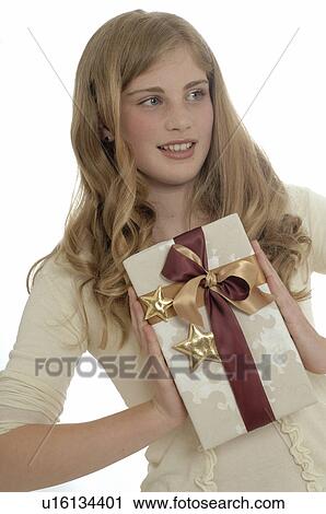 Woman with a Christmas gift View Large Photo Image Stock Image - Woman with a Christmas gift. Fotosearch