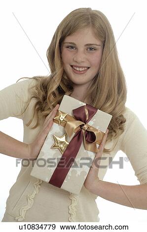 Woman with a Christmas gift View Large Photo Image Stock Photo - Woman with a Christmas gift. Fotosearch