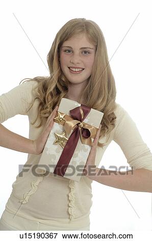 Stock Photo - Woman with a Christmas gift. Fotosearch
