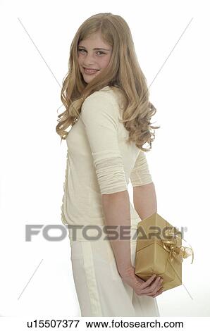 Stock Photo - Woman with a Christmas gift. Fotosearch