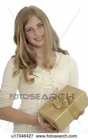 Stock Photo - Woman with a Christmas gift. Fotosearch