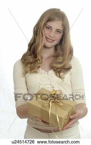 Woman with a Christmas gift View Large Photo Image Stock Photograph - Woman with a Christmas gift. Fotosearch