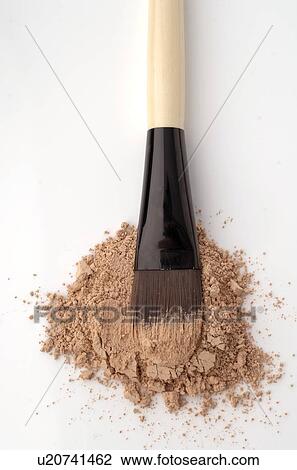Stock Image - Beige powder and brush. Fotosearch