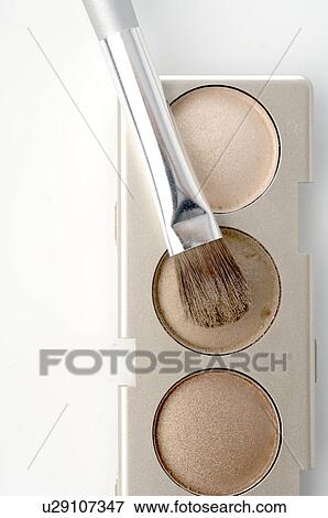 Stock Photo - Beige powder and brush. Fotosearch