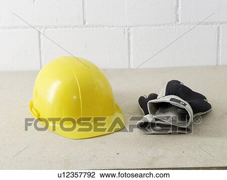 Helmet and working gloves View Large Photo Image Stock Image - Helmet and working gloves. Fotosearch