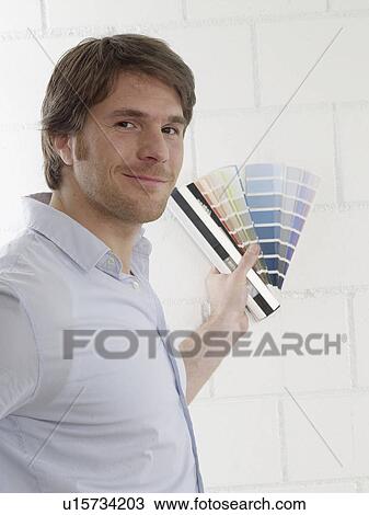 Stock Image - Man with colour palettes. Fotosearch