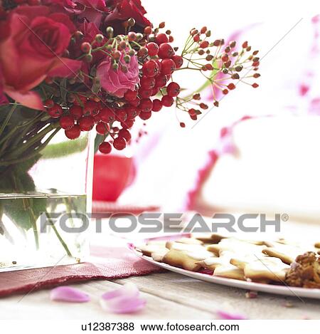 Stock Photo - red bouquet on decorated table. Fotosearch