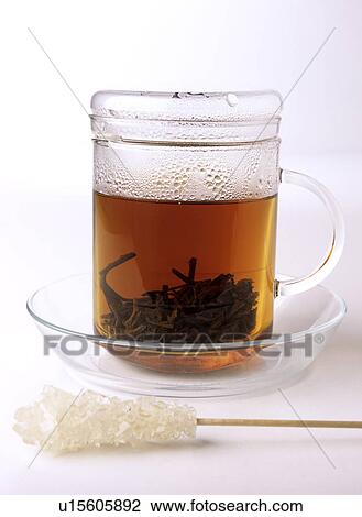 Stock Image - tea glass and sugar. Fotosearch