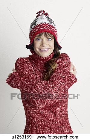 Stock Image - young woman in wintertime. Fotosearch
