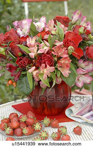 Layed table with bunch of flowers and strawberries View Large Photo Image Stock Photo - Layed table with bunch of flowers and strawberries. Fotosearch