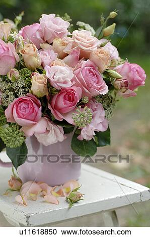 Stock Image - Roses in a damask rose jar. Fotosearch