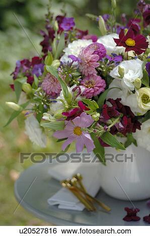 Stock Photograph - Table decoration with bunch of flower. Fotosearch