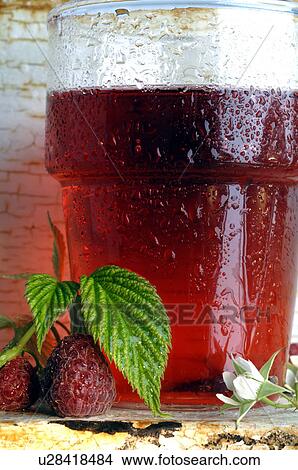 Picture - Glass of raspberry tea. Fotosearch