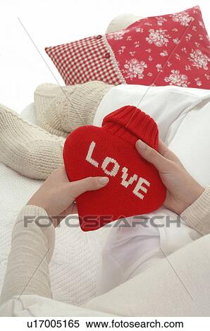 Hot water bottle in heart form View Large Photo Image Stock Photography - Hot water bottle in heart form. Fotosearch