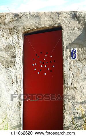 Red door in a white wall View Large Photo Image Stock Image - Red door in a white wall. Fotosearch