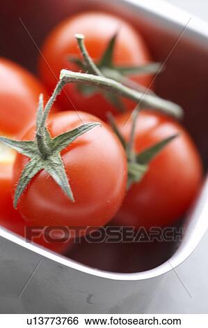 Stock Photograph - Tomatos in a metall box. Fotosearch