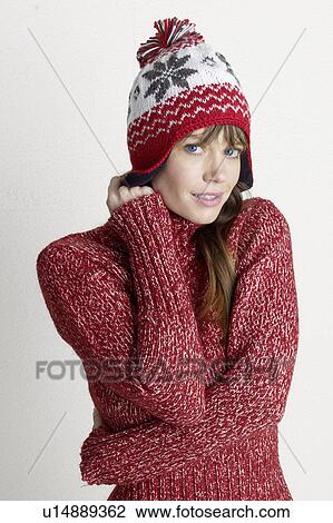 Stock Image - Young woman in a winter pullover. Fotosearch
