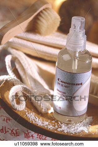 Stock Photo - Coconut oil spray in aerosol can. Fotosearch