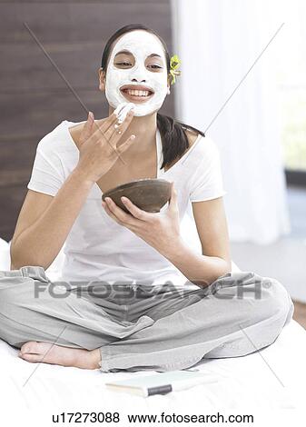 Dark-haired woman with face mask View Large Photo Image Stock Photo - Dark-haired woman with face mask. Fotosearch
