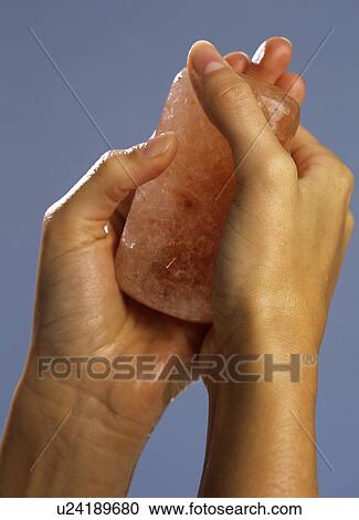 Stock Image - Hands with salt crystals. Fotosearch