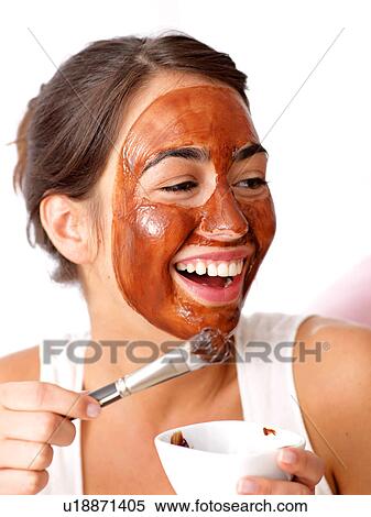 Stock Photography - Laughing woman holding brush. Fotosearch