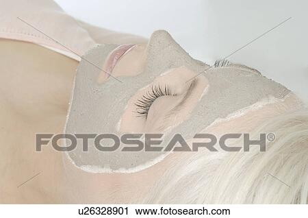Stock Image - Mask with healing earth. Fotosearch